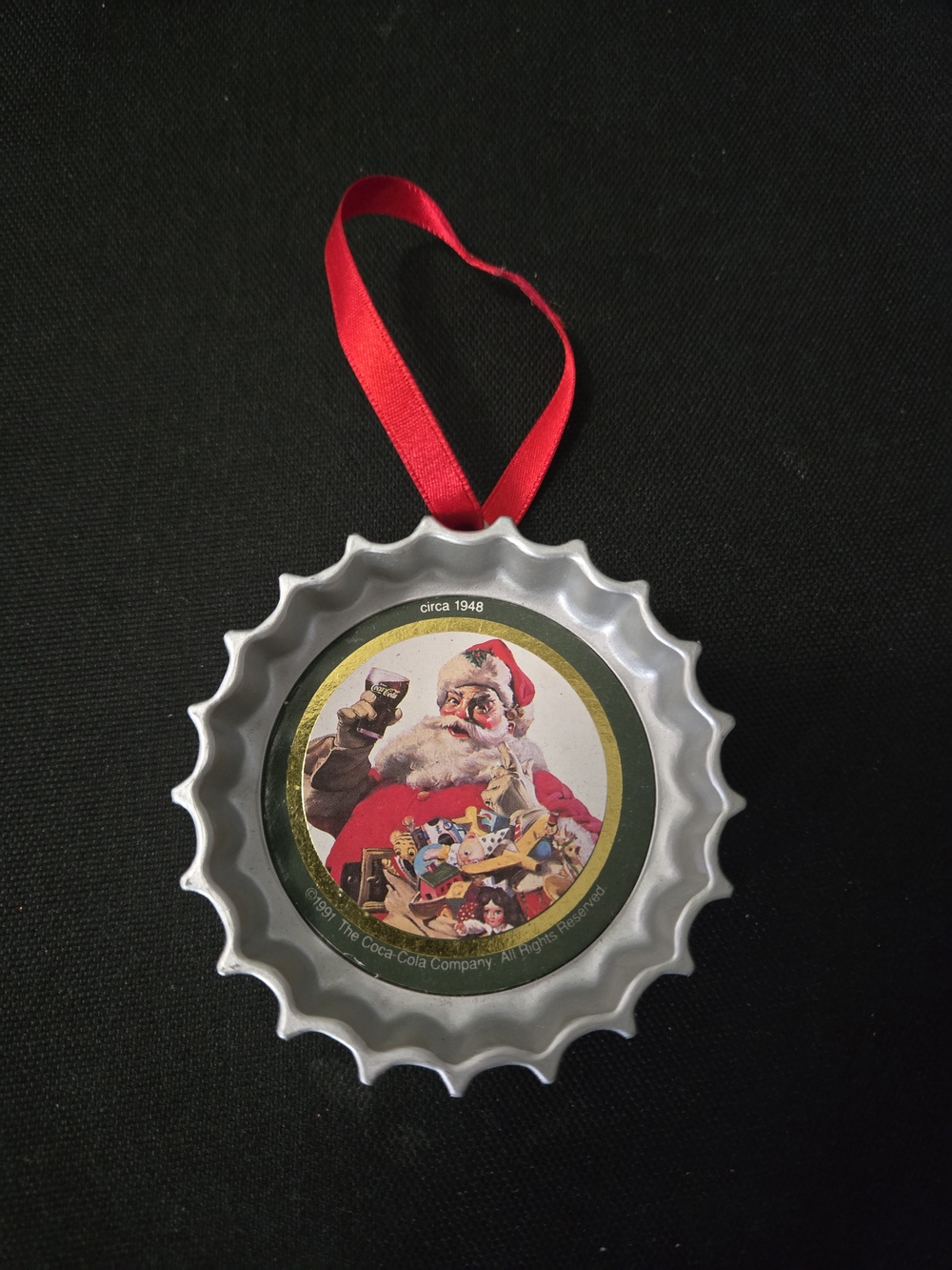 Coca Cola Silver Bottle Cap Ornament with Red Ribbon and Santa Art